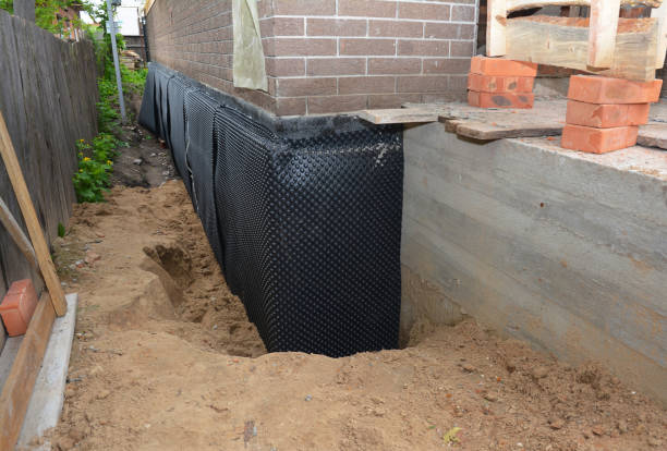 Happy homeowners after waterproofing job in Galien